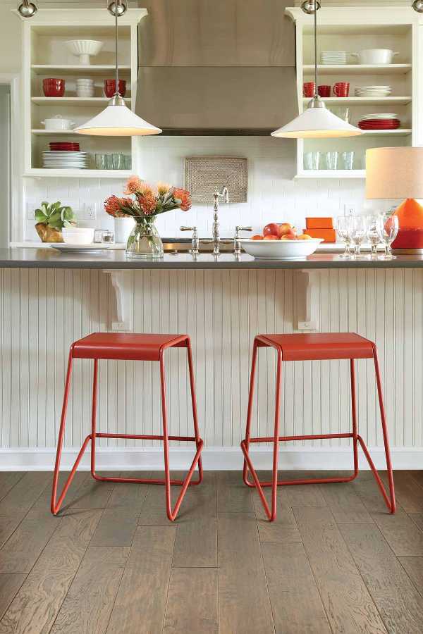 eclectic white kitchen with red accents